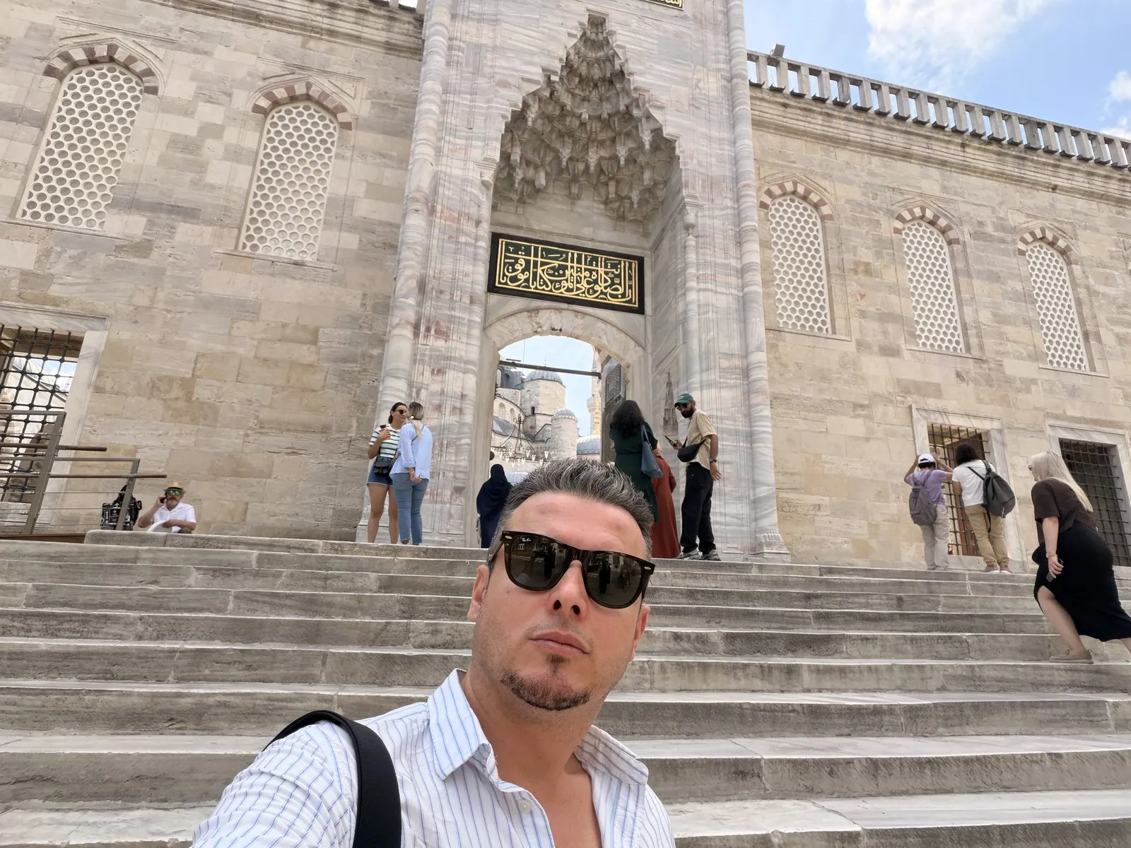 Guide Akın Güzel on the steps of the Blue Mosque courtyard entrance, Sultanahmet, Istanbul