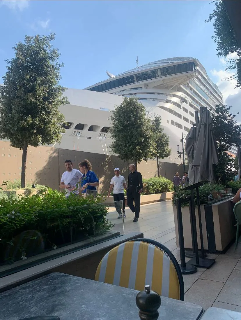 Cruise ship docked at Galataport Istanbul seen from a waterfront café