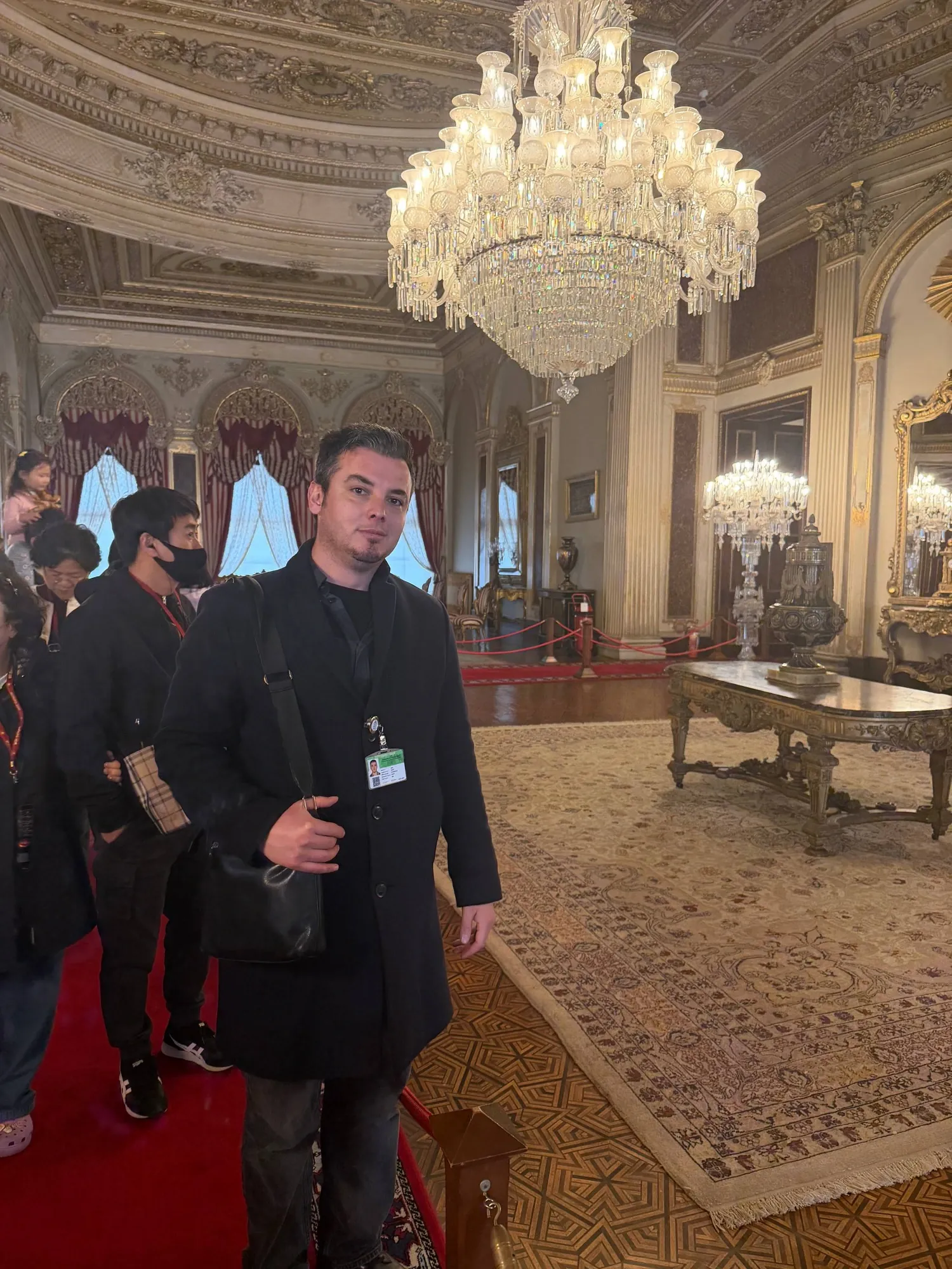 Guide Akın in the chandelier-lit halls of Dolmabahçe Palace, Istanbul