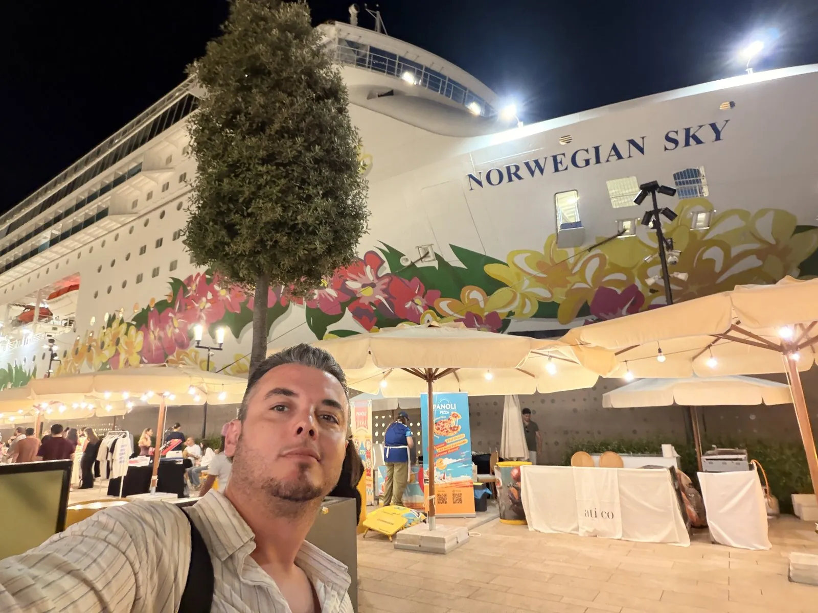 Guide Akın Güzel at Galataport Istanbul cruise port with a cruise ship docked behind